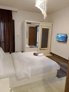 شقة دوبلكس مستوي فندقي بورتو كايرو التجمع الخامس عائليه704 c