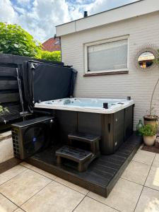 Sfeervol Tiny House met luxe jacuzzi & tuinkamer