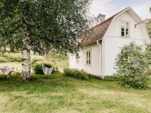 Cozy wooden house with wood stove in Småland