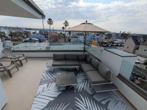 Steps from Ocean! Ocean and Bay Views! Rooftop Deck! Two-Car Garage! Renovated!