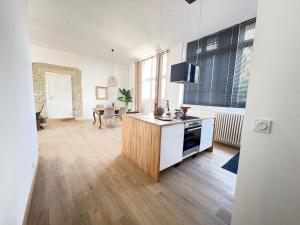Appartements La LOGE entre Pierre & Histoire : photos des chambres