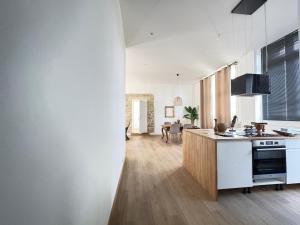 Appartements La LOGE entre Pierre & Histoire : photos des chambres