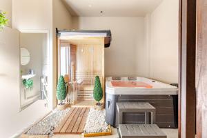 Appartements Duplex Luxe - Sauna & Jacuzzi Privatif : photos des chambres