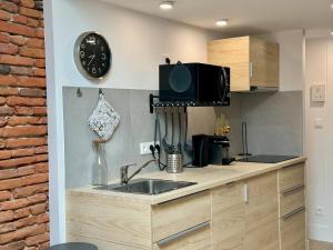 Appartements Studio place du Capitole climatisation : photos des chambres