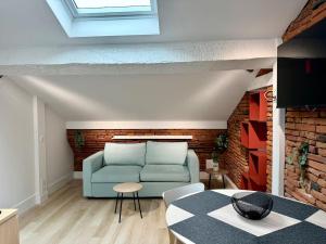 Appartements Studio place du Capitole climatisation : photos des chambres