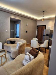 elegant executive fully furnished three bedroom apartment with ample parking space, swimming pool fully equipped gym children playing ground and amazing city views