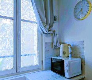 Appartements Au Petit Trianon Bleu : photos des chambres