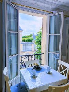 Appartements Au Petit Trianon Bleu : photos des chambres