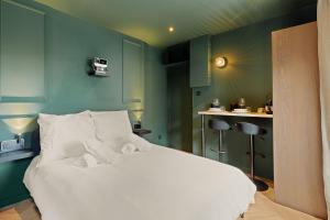 Appartements Suite Emeraude : photos des chambres