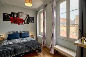 Appartements Appartement spacieux et parking : photos des chambres