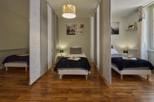 Appartements Appartement spacieux et parking : photos des chambres