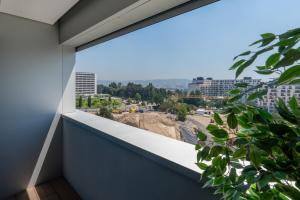 Stylish Home with Balcony & Garage by HostWise