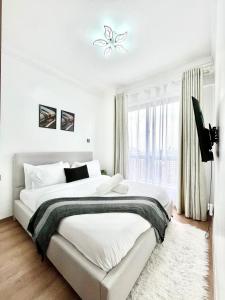 Beautifully and Elegantly furnished three bedroom with swimming pool fully equipped gym ample parking ,children playing ground and amazing scenic city views