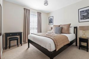 Central 2BR Park Royal Apartment with Balcony and Parking