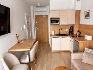 Nadmorski Relaks - komfortowy apartament blisko plaży w Sunset Resort