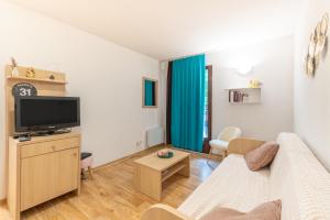 Appartements Un Jardin Au Coeur De Luchon : photos des chambres