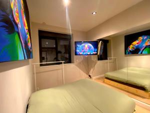 Villas Capsule la grange arcade de jeux billard 4 chambres 300m2 : photos des chambres