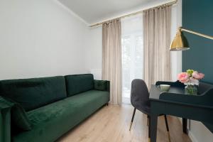 Dark Green Apartment in Wrocław Center with Desk and Balcony by Noclegi Renters