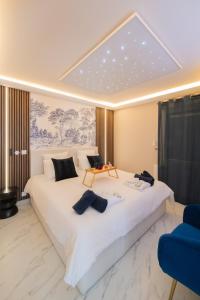 Appartements L-Escapade Indigo - Balneo - Sauna : photos des chambres