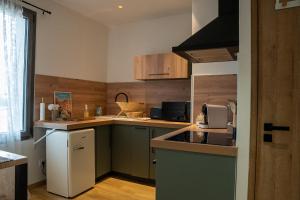 La Maison PP - Appartements : photos des chambres