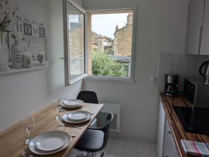 Appartements Joli appartement coeur de ville : photos des chambres