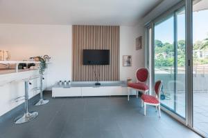 Appartements Le Bagnols - Appartement 2 ch parking et piscine : photos des chambres