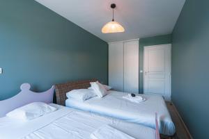 Appartements Le Bagnols - Appartement 2 ch parking et piscine : photos des chambres