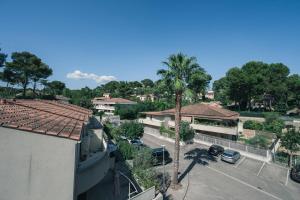 Appartements Le Bagnols - Appartement 2 ch parking et piscine : photos des chambres