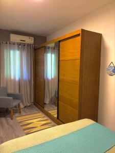 Casa de praia com ar condicionado.