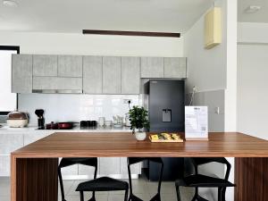 NEW Designer Condo - Panoramic Forest View - Steps To IOI City Mall - Your Best Urban Retreat