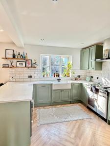 Stylish 4-Bed Home with Ensuites, Garden & Parking