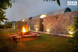 StayVista at The Stone Age Home with Pool, Lawn, BBQ & Bonfire