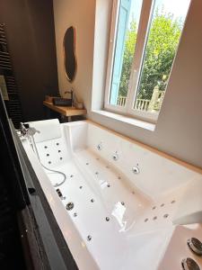 Appartements Craft Home - Le menuisier - Balneo - Parking prive : photos des chambres