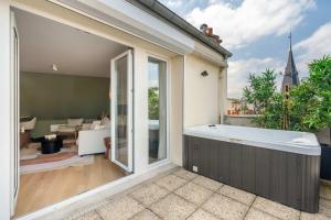 Appartements New loft with terrace & jacuzzi near Montparnasse : photos des chambres
