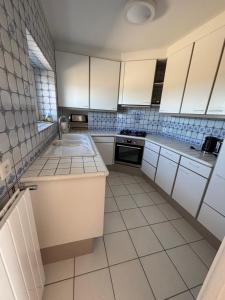 House near wild coast and castle