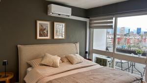 Amplio dpto a pasos del Parque Arauco con Aire Acondicionado