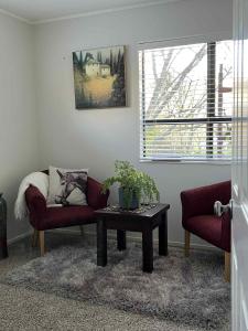 Rose Cottage - private suite - bedroom, lounge, bathroom and kitchenette