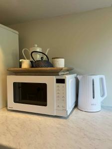 Rose Cottage - private suite - bedroom, lounge, bathroom and kitchenette