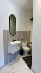 The Monochrome Apartment 209 - Urban Chic Escape - Open Plan Bathroom with Bathtub