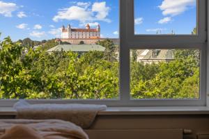 Modern city-center apartment with castle view