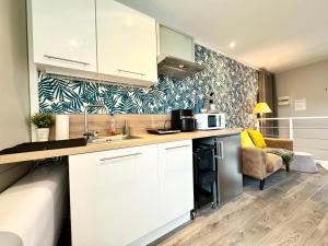 Appartements La Fleur Bleue - Cozy Apartment : photos des chambres