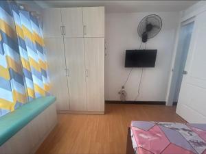 Minimalist Room in Imus Condo with netflix and round-clock Security