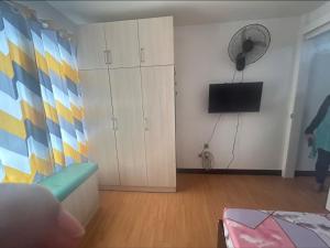 Minimalist Room in Imus Condo with netflix and round-clock Security