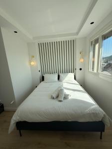 Appartements RIVIERA - 2 Pieces de Charme - Vue Lac - Clim - Parking : photos des chambres
