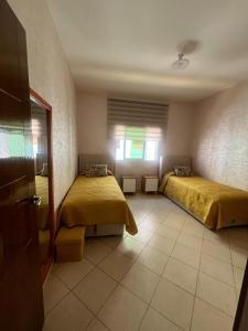 appartement Anna 2 chambres et salon balcons de avec piscine bien situé au centre de oued laou