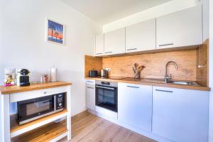 Appartements Appartement Fleuri vue mer - Welkeys : photos des chambres