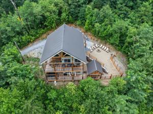 Out of the Ashes is a brand new 3 bedroom cabin with high end touches, hot tub, and a mountain view!