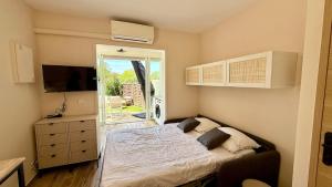 Studio avec jardin parking wifi climatisation