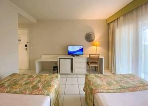 Suíte aconchegante vista jardim