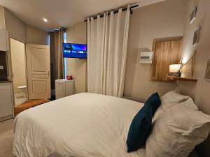 Appartements Aux-Cerfs - Studio coeur de ville : photos des chambres